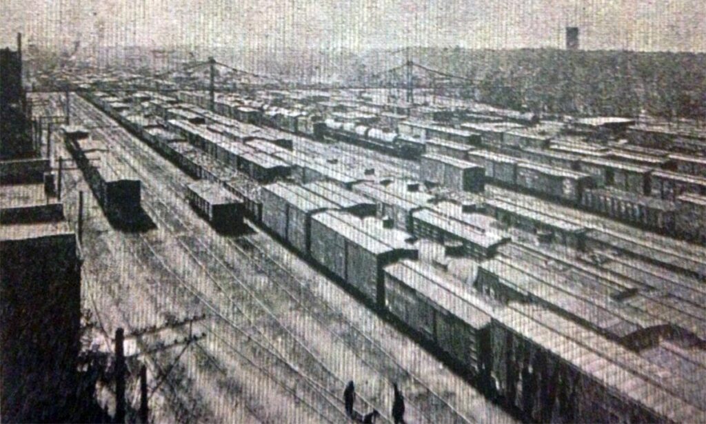 historic black and white photo of rail yard on Commercial Street